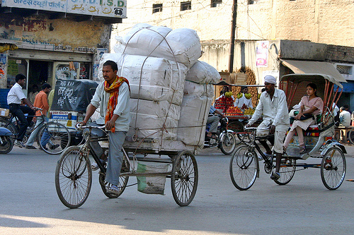 Load carrying bikes in Varanasi, India. Photo by dirk huijssoon.