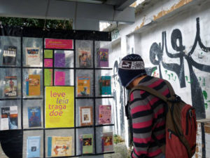 A passenger peruses a book stop in Brazil