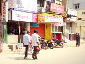 Men walk down the street in India