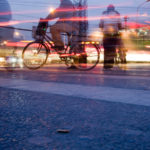 Biker in city night. Photo by Bridget Coila/Flickr