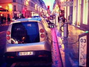 An electric Autolib' vehicle charges in Paris, France. Photo by Cokul/Flickr.