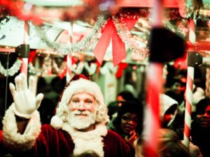 Santa waves from Chicago's "Santa Train." Photo by Boqiang Liao/Flickr.