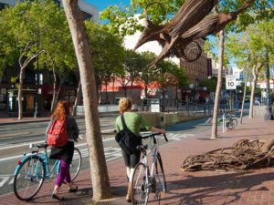 Two cyclists on Market Street in San Francisco, California. Photo by Sergio Ruiz/Flickr.