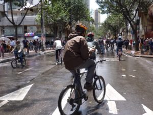 A person bikes in Bogota, Columbia, during the city's car-free week. Photo by M.Erwert/Flickr.