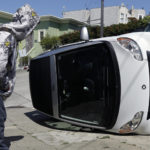 Smart car tipped in San Francisco, California. Photo by Jeff Chiu.