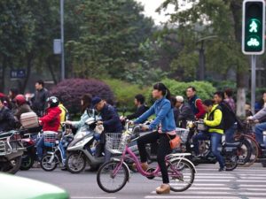 The rise of electric bikes in China necessitates infrastructure and policy shifts to ensure safety for all road users. Photo by Maciej Hrynczyszyn/Flickr.