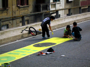 Painting the streets in honor of the World Cup is community tradition in cities across Brazil, and one for all ages. Photo by Dylan Passmore/Flickr.