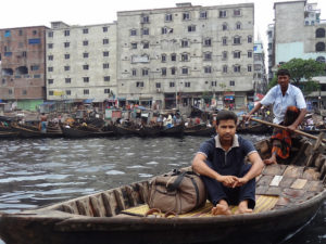 The Buriganga River in the Bangladeshi city of Dhaka provides transport for the city---yet reminds Dhaka's residents of the need to build resiliency into the city as water levels rise. Photo by William Veerbeek/Flickr.