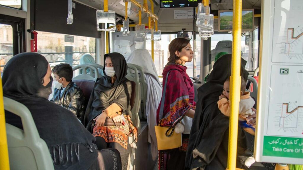 People riding the bus in Peshawar, Pakistan